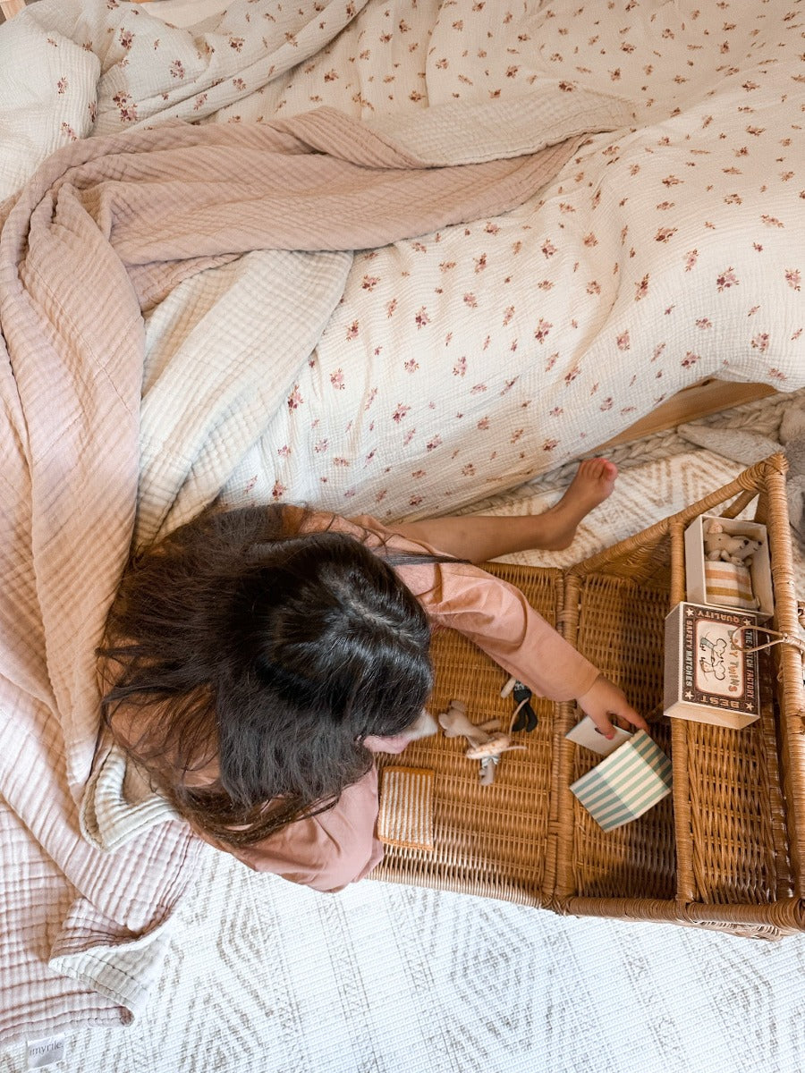 Gorgeous girls plays with Maileg mice beside her beautiful bed with stunning scandi inspired bedding with Aussie natives and all in 100% GOTS organic cotton. Every girls dream