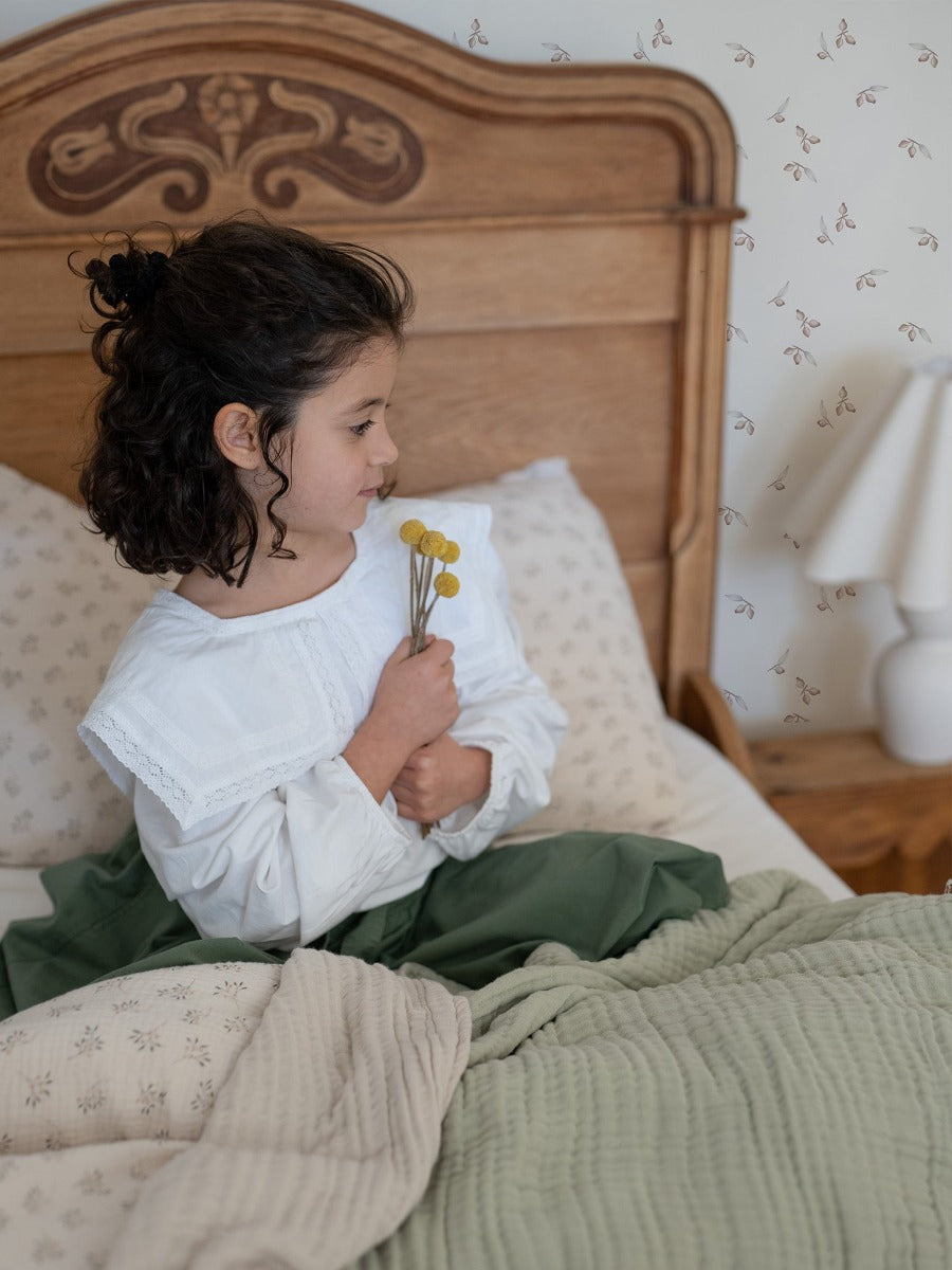 Sleigh bed and Billy Button with our neutral and moss Softie is what dreams are made. Seen here in this gorgeous vintage girls bedroom thrown over our eucalyptus single bed sheets. It is dreamy and magical all at the same time.