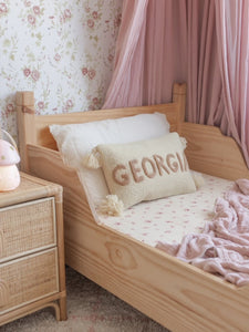 Wood sleigh bed, flower wallpaper and beautiful organic cotton bed sheets. Everything a dream girls room can be. The soft drapes, the pinks, vintage feel make Georgia one lucky girl to have this room as her own.