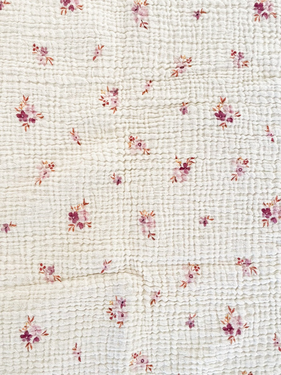 The best GOTS Organic Cotton Baby Bassinet Sheet with a vintage scandi feel and an Australian Wax Flower design on a neutral background