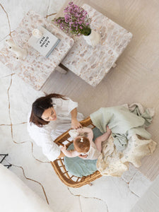 The best low-tox bassinet and cot sheets, scandi floral swaddles, and crinkled gauze blankets made from 100% GOTS organic cotton.