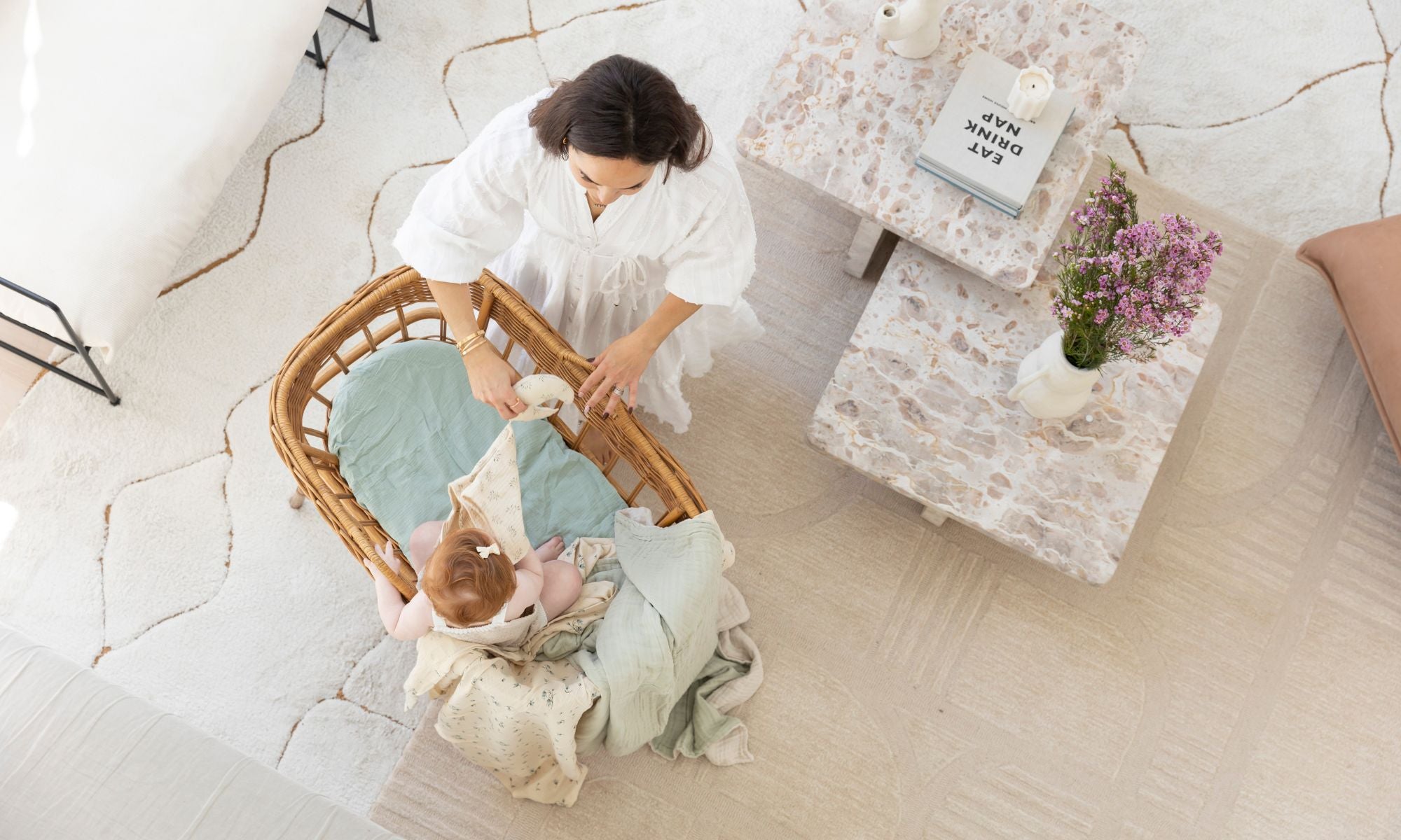 The best low-tox bassinet and cot sheets, scandi floral swaddles, and crinkled gauze blankets made from 100% GOTS organic cotton.