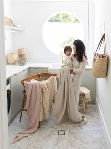 The best low-tox bassinet and cot sheets, scandi floral swaddles, and crinkled gauze blankets made from 100% GOTS organic cotton.