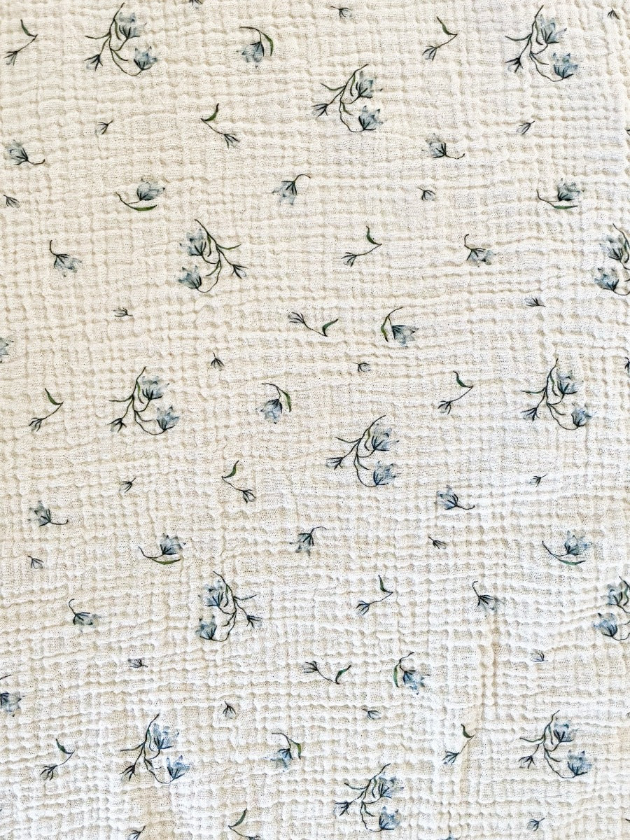 The best ethically made GOTS organic cotton fitted bassinet sheets. So soft in crinkled vintage Australian bluebell design