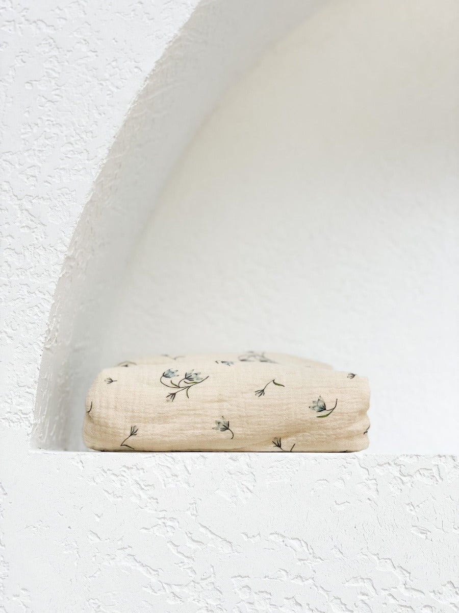 The best ethically made GOTS organic cotton fitted bassinet sheets. So soft in crinkled vintage Australian bluebell design