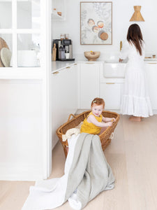 Baby in cane bassinet whilst mum does the washing. A great super soft blanket to put against your baby or toddler or even yourself